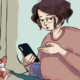 Women with glasses checking her cats symptom on her phone setting her cats next to her